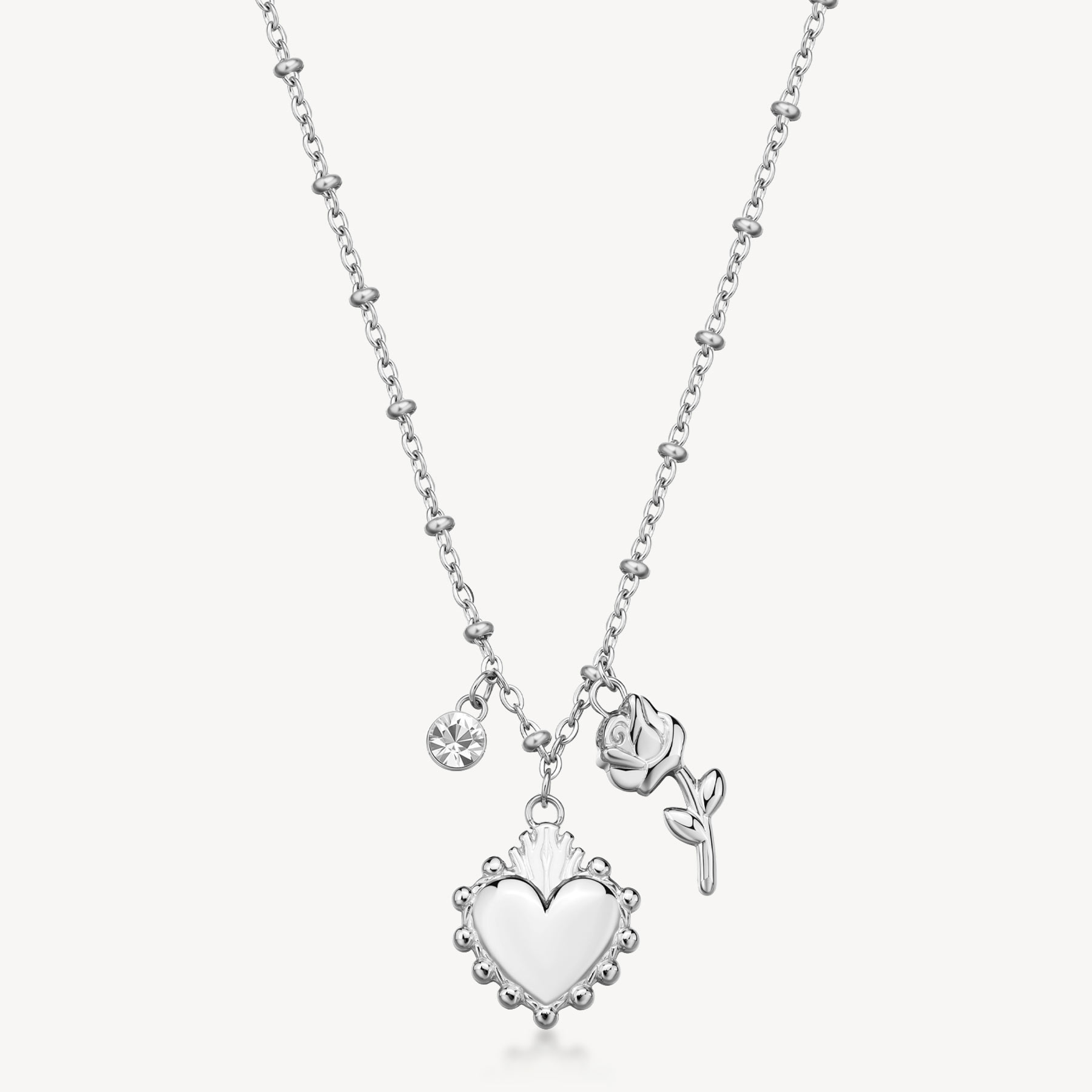 Collana CHAKRA in acciaio 316L, con pendenti sacro cuore e rosa